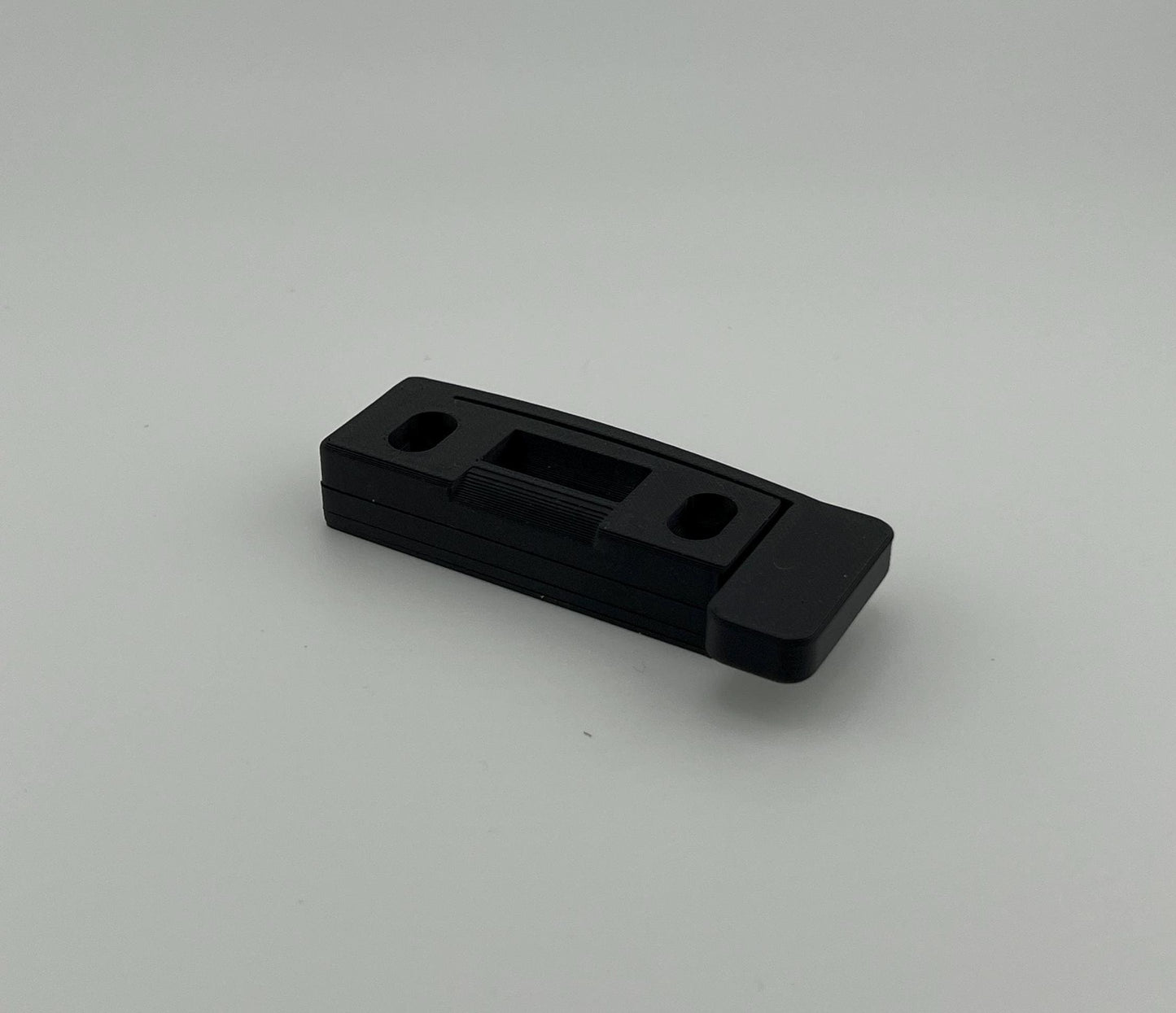 A variety of shims are provided and may be stacked under the strike plate to minimize the gap between the striker and the plate.