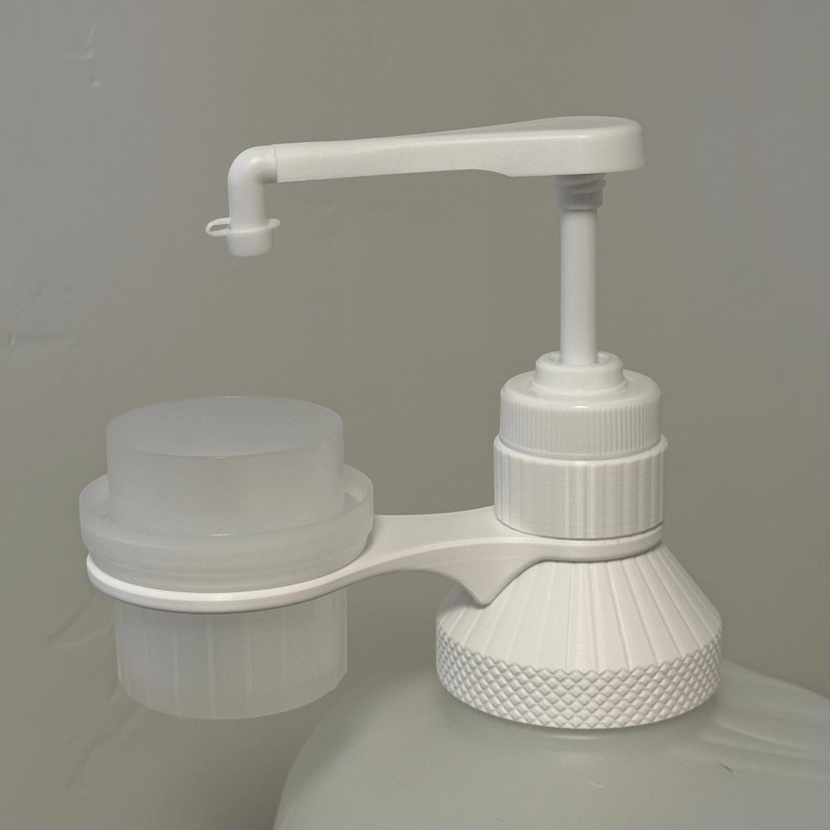 Hand pump dispenser for ECOS laundry detergent bottle. Fits giant 225 fl oz. size from Costco!
